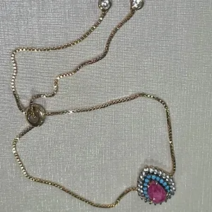 PULSEIRA REGULÁVEL - CRAVEJADA ZIRCONIAS - NANO TURQUESA - GOTA - BANHO OURO 18K