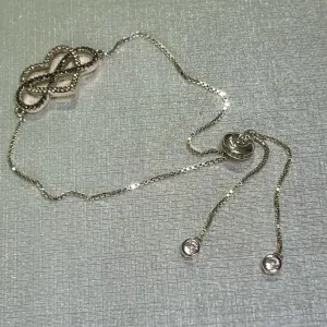 PULSEIRA REGULÁVEL - INFINITO - CORAÇÃO - BANHO RODIO BRANCO
