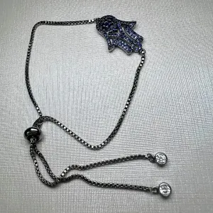 PULSEIRA REGULAVEL - MÃO DE FATIMA - BANHO RODIO NEGRO