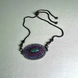 PULSEIRA CRAVEJADA ZIRCONIAS COLORIDAS - OVAL - BANHO RÓDIO NEGRO