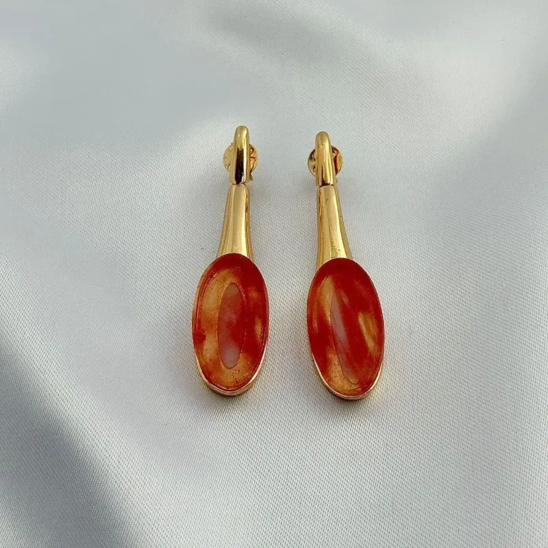 BRINCO CRISTAL LARANJA - BANHO DE OURO 18K